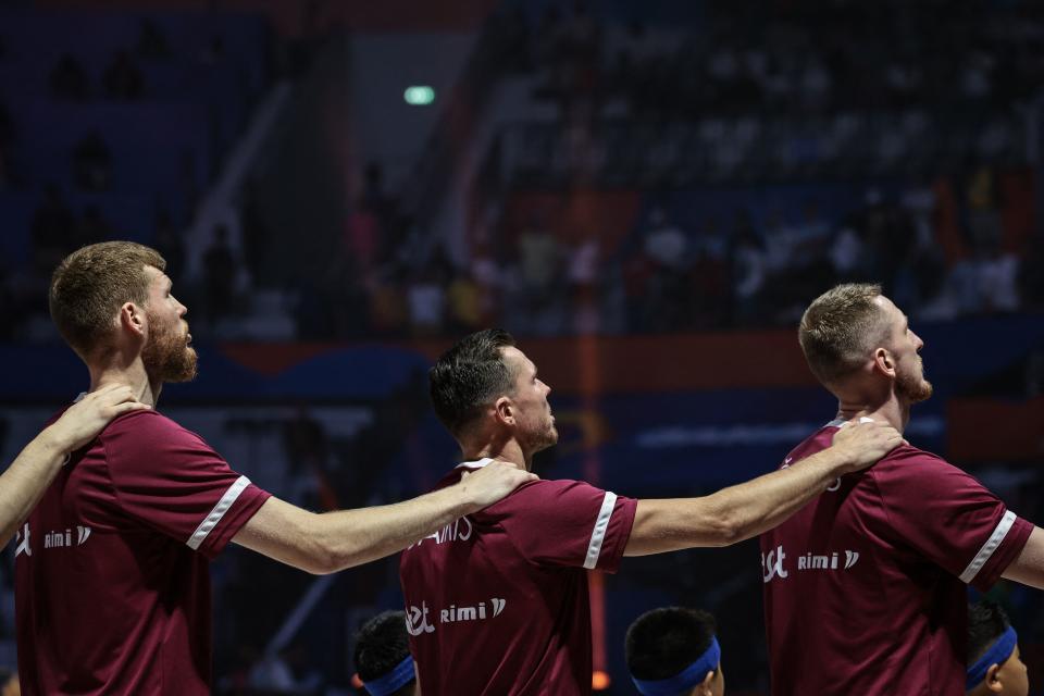 Latvia’s Dairis <a class="link " href="https://sports.yahoo.com/nba/players/4926" data-i13n="sec:content-canvas;subsec:anchor_text;elm:context_link" data-ylk="slk:Bertans;sec:content-canvas;subsec:anchor_text;elm:context_link;itc:0">Bertans</a> (L) puts his hands on Davis Bertans (C) as they sing the national anthem during the FIBA Basketball World Cup group L match between Brazil and Latvia at Indonesia Arena in Jakarta on September 3, 2023. (Photo by Yasuyoshi CHIBA / AFP) (Photo by YASUYOSHI CHIBA/AFP via Getty Images)