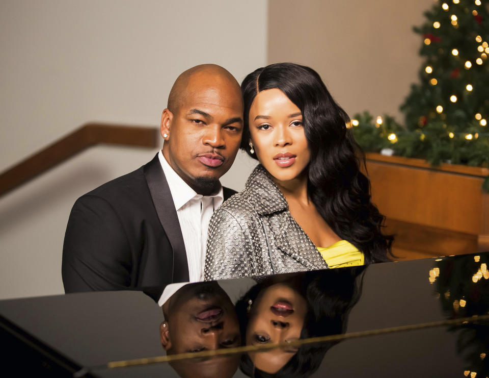 This image released by BET shows Ne-Yo, left, and Serayah in a scene from "The Sound of Christmas," airing Dec. 9 on BET and BET Her. (BET via AP)