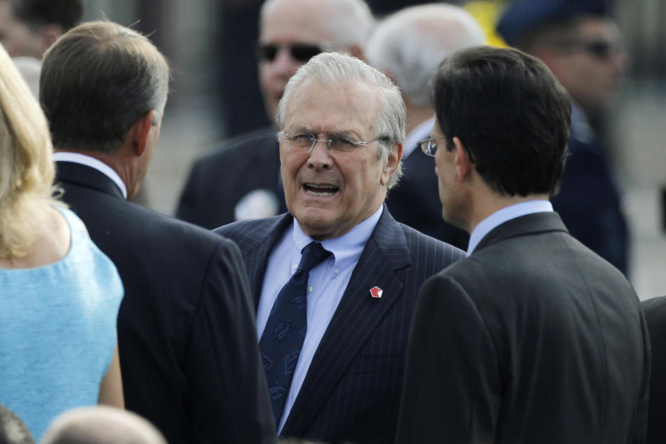 Former U.S. Secretary of Defense Rumsfeld talks to Speaker of the House Boehner and House Majority Leader Cantor in Washington