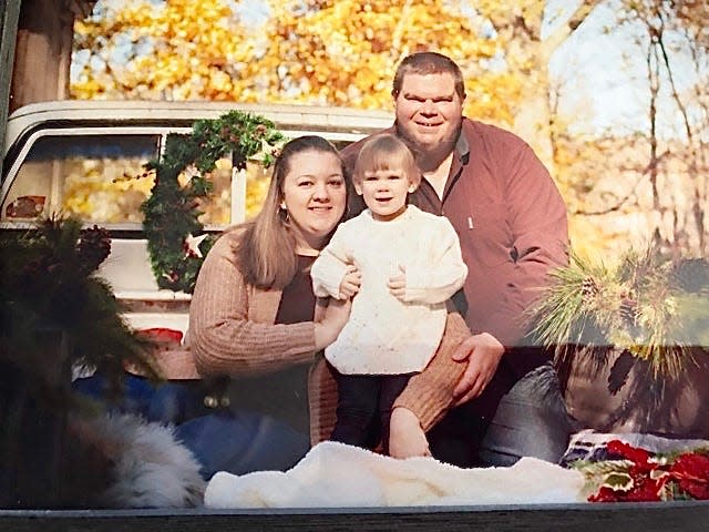 C.J. Minnick, right, with his wife Lisa and daughter Kaylee.