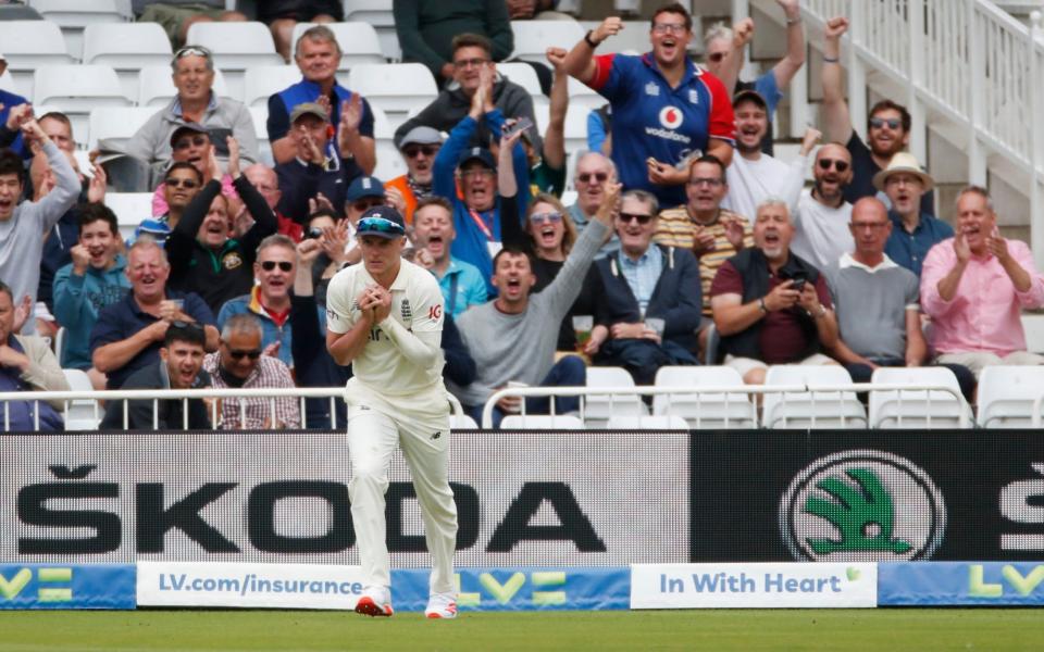 England's Sam Curran takes a catch to dismiss India's Rohit Sharma - Action Images via Reuters/Paul Childs