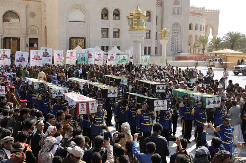 FILE PHOTO: Honour guards carry coffins of Houthi fighters killed in recent fighting against government forces in Yemen's oil-rich province of Marib, during a funeral procession in Sanaa