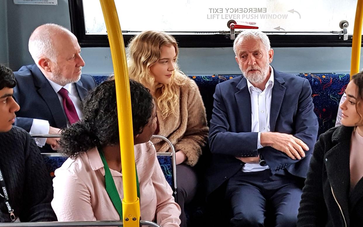 Andy McDonald, left, on a bus with Jeremy Corbyn -  Dave Higgens/PA