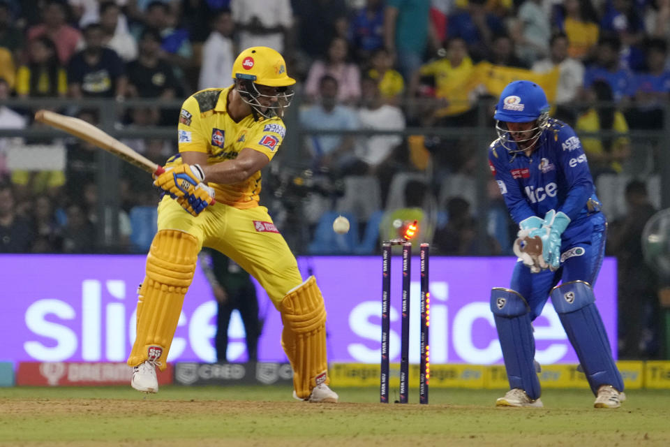 Chennai Super Kings' Shivam Dube is bowled by Mumbai Indians' Kumar Kartikeya during the Indian Premier League (IPL) cricket match between Mumbai Indians and Chennai Super Kings in Mumbai, India, Saturday, April 8, 2023. (AP Photo/Rajanish Kakade)