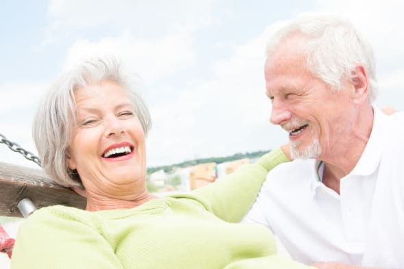 smiling senior couple at the...