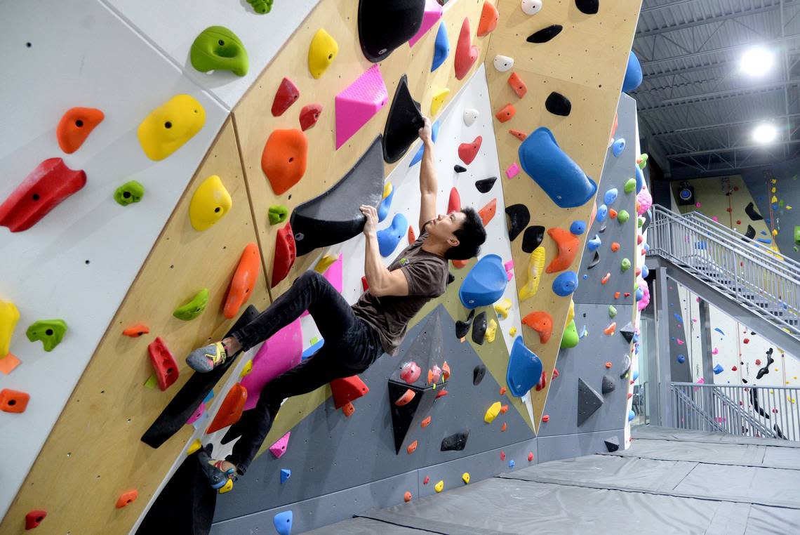 Macon Rocks operations manager John Hur climbs one of the bouldering walls prior to the opening of this family-friendly space in this Telegraph file photo.