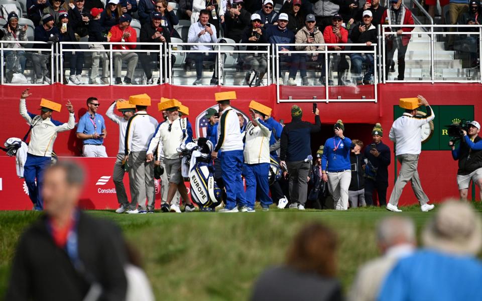 Team Europe arrive with their cheese hats - PA