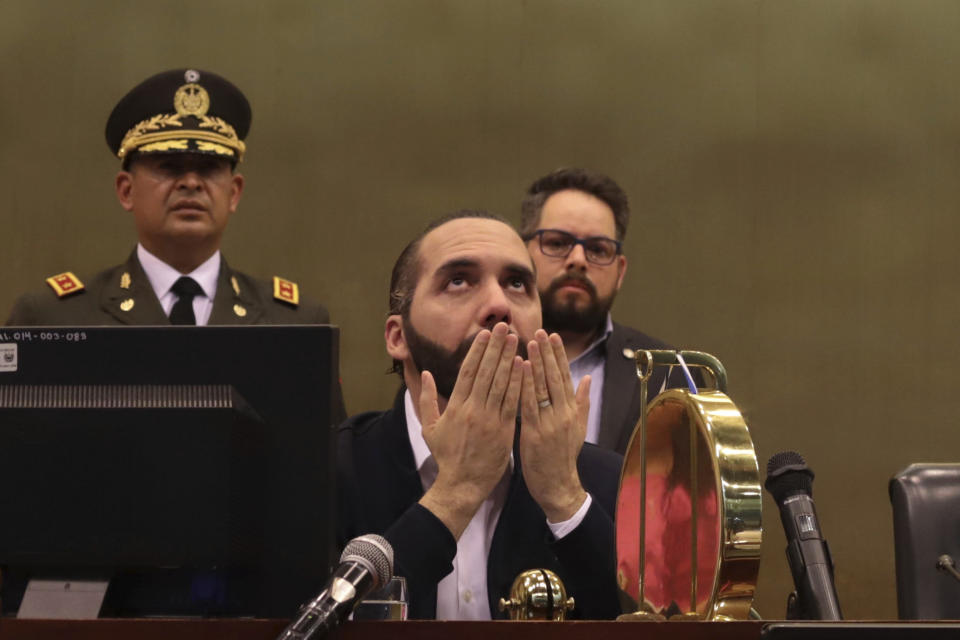 FILE - In this they Feb. 9, 2020 file photo, El Salvador's President Nayib Bukele offers a prayer in congress, after he had been locked in battle with the opposition-controlled congress, pressuring lawmakers to approve funding for a security plan to control gangs, in San Salvador, El Salvador. “If we wanted to press the button, we would press the button” and remove lawmakers from the legislature, he told supporters gathered outside the building. “But I asked God and God told me: patience, patience, patience.” (AP Photo/Salvador Melendez, File)