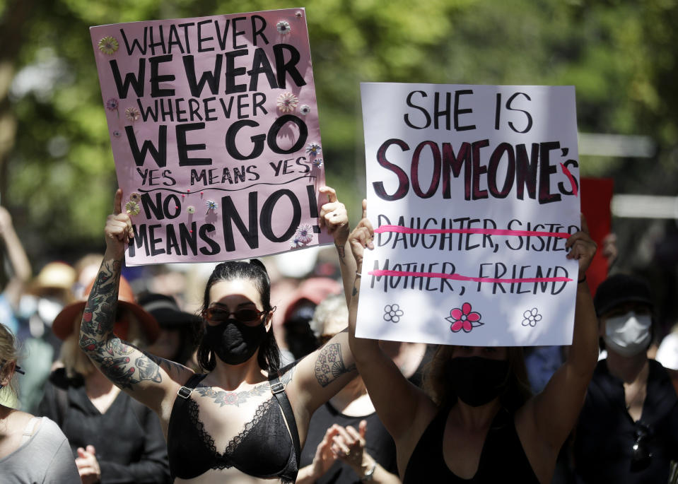 Thousands of people with placards and banners rally demanding justice for women in Sydney, Monday, March 15, 2021, as the government reels from two separate allegations. The rally was one of several across Australia including in Canberra, Melbourne, Brisbane and Hobart calling out sexism, misogyny and dangerous workplace cultures. (AP Photo/Rick Rycroft)