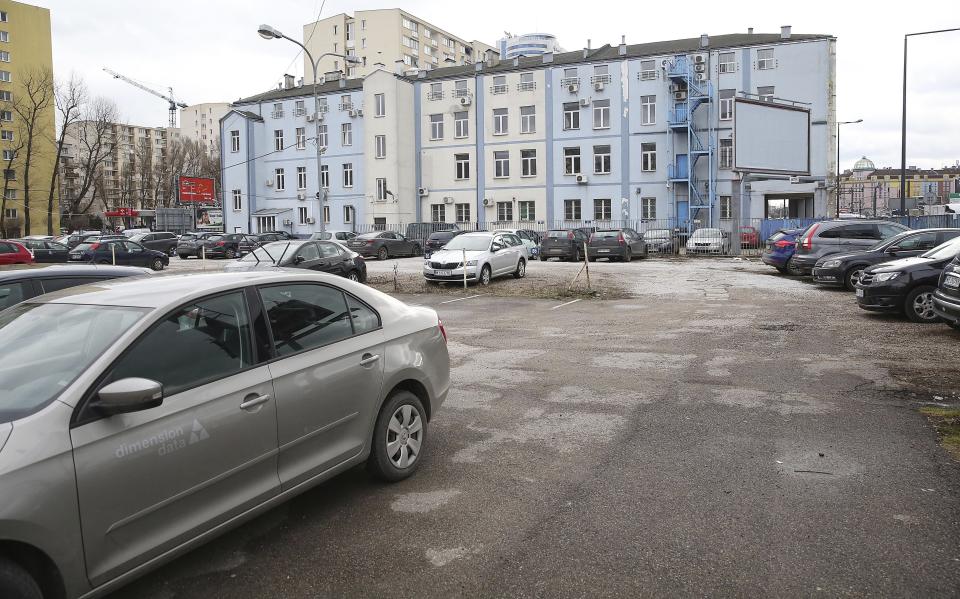 A plot of land and an old building that would have to be torn down if a foundation headed by Poland's ruling party leader Jaroslaw Kaczynski was to go ahead with its plan to build twin towers there, in Warsaw, Poland, Monday, Feb. 11, 2019. The plan has put Kaczynski in political dire straits. Kaczynski's public image being that of restraint and honesty, he is at the center of a scandal involving him negotiating the multi-million euro construction project, even though the law bans political parties from doing business. (AP Photo/Czarek Sokolowski)