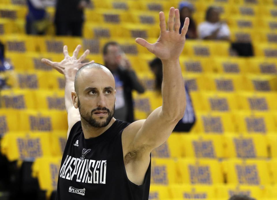 Manu Ginobili shows you that there is nothing up his sleeve. (AP)