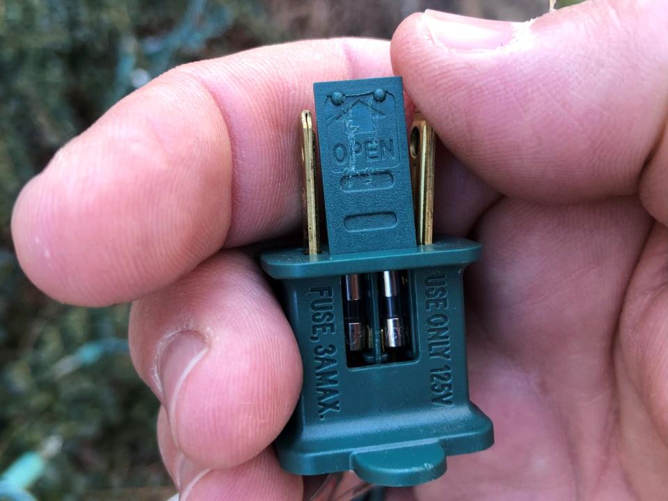 Replacing Christmas light fuses involves opening a small door on the plug and removing and replacing the bad fuse or fuses.