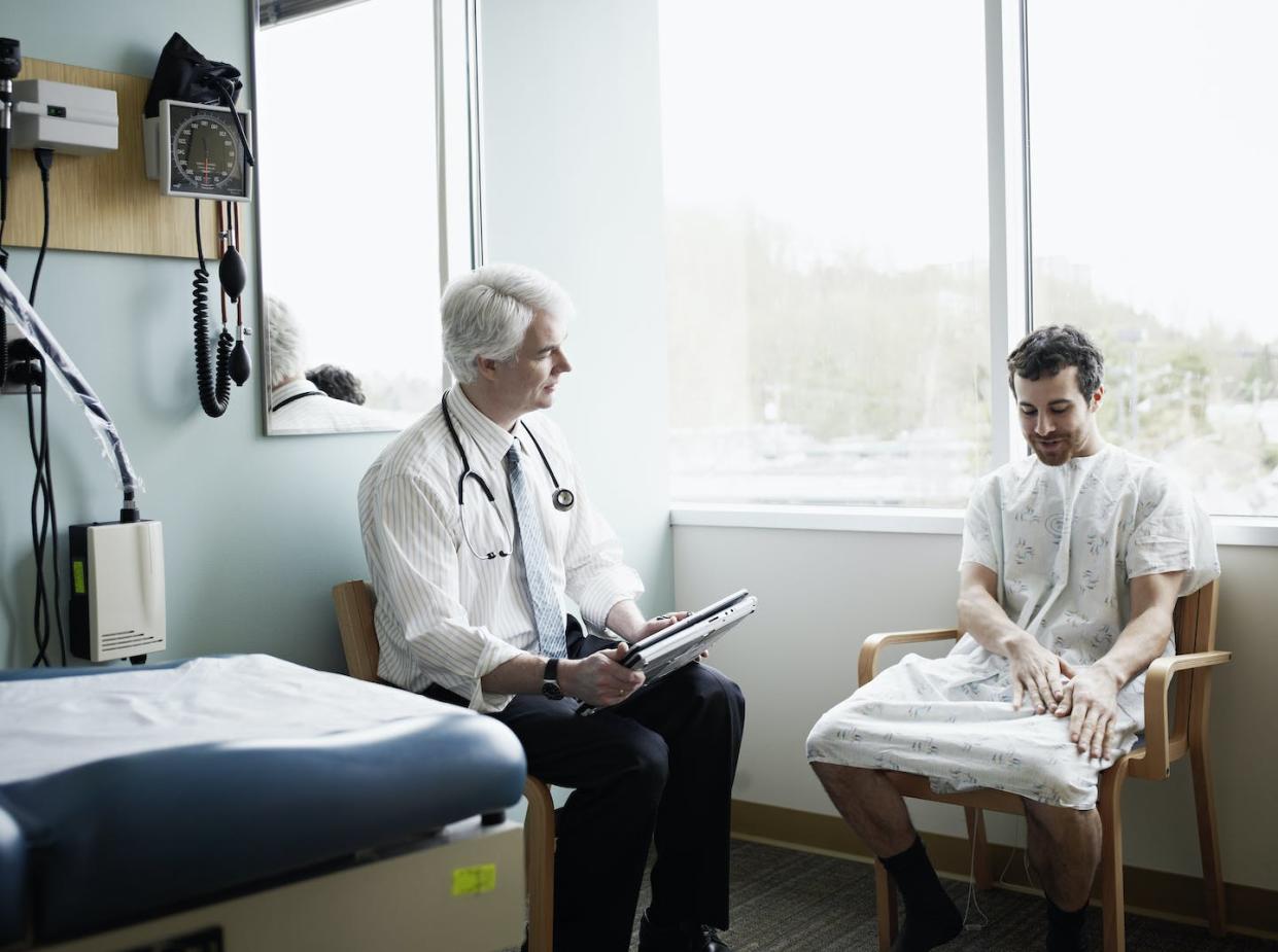 This year, many vasectomy patients are young or single men concerned about unwanted pregnancy at a time when abortion care may not be as available as before. <a href="https://www.gettyimages.com/detail/photo/doctor-in-discussion-with-patient-in-exam-room-royalty-free-image/97863283" rel="nofollow noopener" target="_blank" data-ylk="slk:Thomas Barwick/Stone via Getty Images;elm:context_link;itc:0;sec:content-canvas" class="link ">Thomas Barwick/Stone via Getty Images</a>