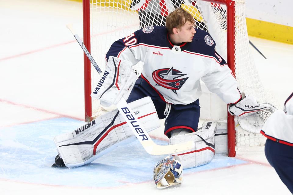 Columbus Blue Jackets goaltender Daniil Tarasov loses his mask during the third period of the team's NHL hockey game against the Buffalo Sabres on Tuesday, Dec. 19, 2023, in Buffalo, N.Y. (AP Photo/Jeffrey T. Barnes)