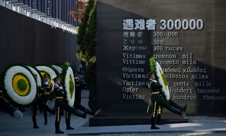 Soldiers of the People's Liberation Army attend a memorial ceremony at the Memorial Hall of the Victims in Nanjing Massacre, in Nanjing city on December 13, 2014