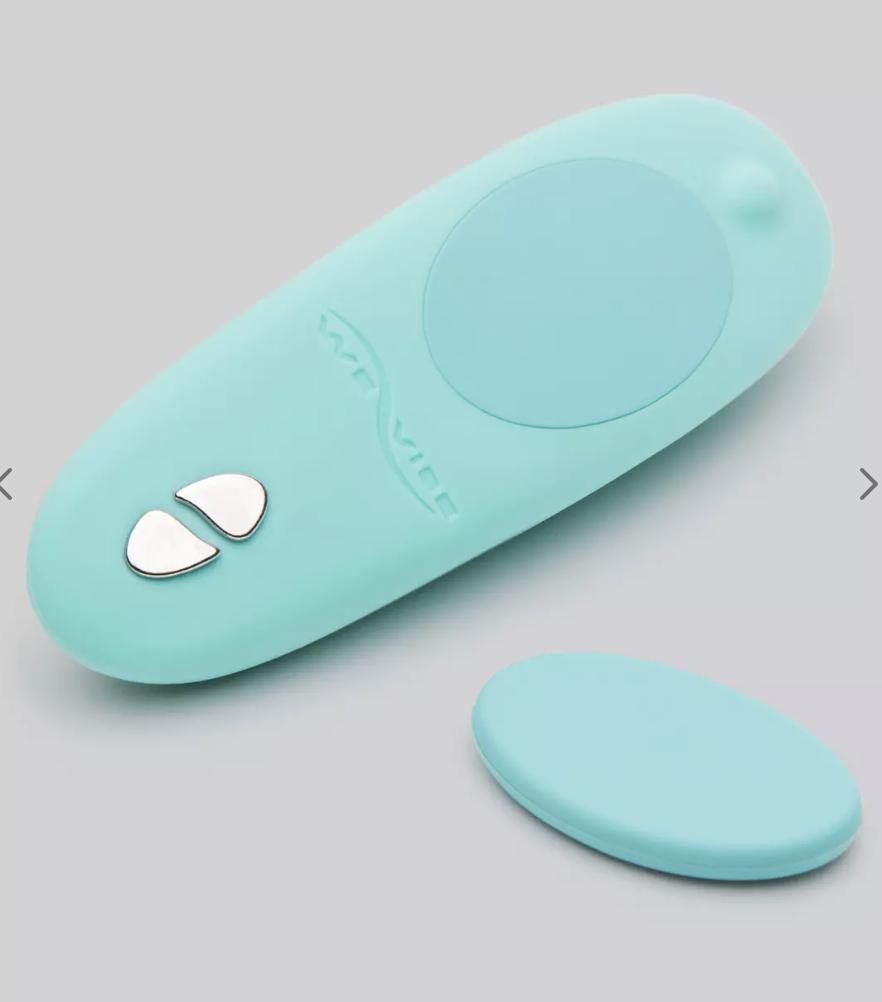 A sea-green oval shaped We-Vibe Moxie App and Remote Controlled Wearable Clitoral Knicker Vibrator with magnetic clip sits on a grey background.