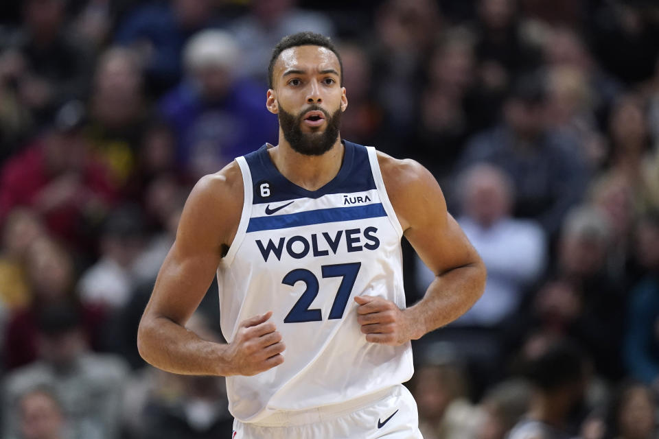 Minnesota Timberwolves center Rudy Gobert runs up the court during the first half of the team's NBA basketball game against the Utah Jazz on Friday, Dec. 9, 2022, in Salt Lake City. (AP Photo/Rick Bowmer)