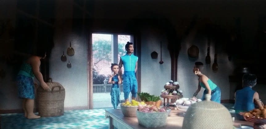 Raya and her father, Chief Benja, walk into the kitchen, which has mangosteens and dragon fruit