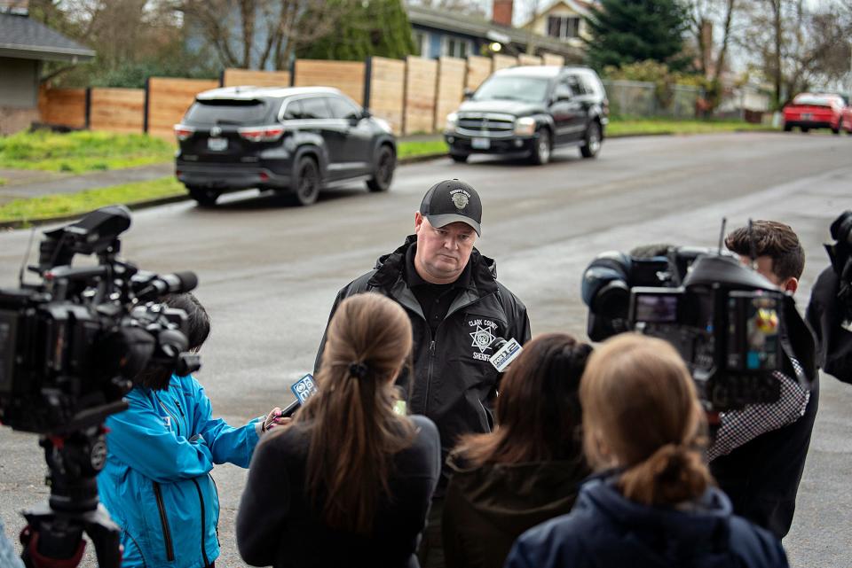 Sgt. Chris Skidmore, center, speaks to members of the media after five people were killed in a shooting, including the shooter, at a home in Orchards, Monday, Dec. 4, 2023, in. Vancouver, Wash. The Clark County Sheriff’s Office said the deaths Sunday appeared to be a murder-suicide. (Amanda Cowan/The Columbian via AP) ORG XMIT: WAVAN