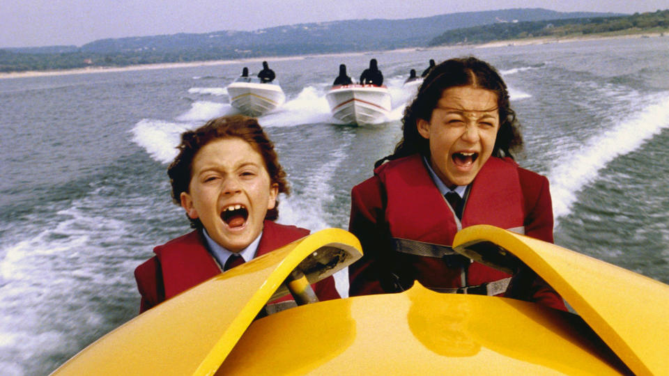 (L, R) Daryl Sabara and Alexa Vega as Juni and Carmen Cortez, in a speedboat in Spy Kids
