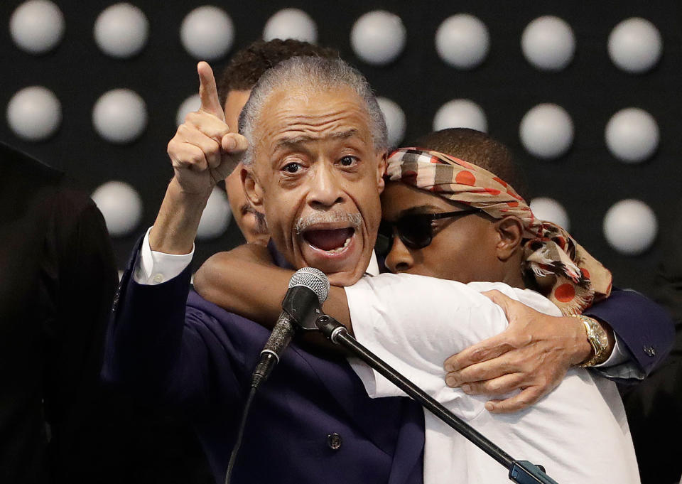 <p>Rev. Al Sharpton, left, hugs Stevante Clark while speaking during the funeral services for police shooting victim Stephon Clark at Bayside Of South Sacramento Church in Sacramento, Calif., Thursday, March 29, 2018. (Photo: Jeff Chiu, Pool/AP) </p>