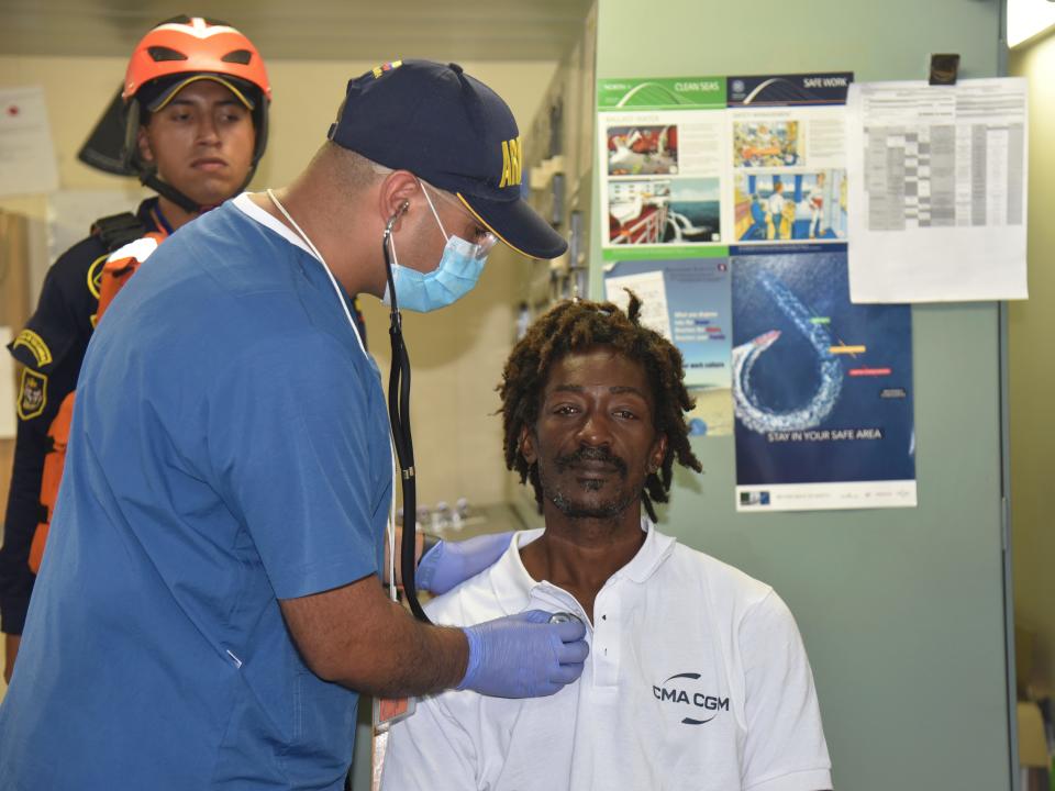 In this photo provided by Colombia's Navy press office, castaway Elvis Francois is attended by Colombian Navy members after he was rescued near the department of La Guajira, in the extreme north of Colombia, as he sits on board the merchant ship CMA CGM Voltario at the port of Cartagena, Colombia, Monday, Jan. 16, 2023. According to the Navy, the 47-year-old from Dominica said he had been adrift for 24 days in the Caribbean Sea after he was repairing a boat last December near the island of Sint-Maarten in the Netherlands Antilles.