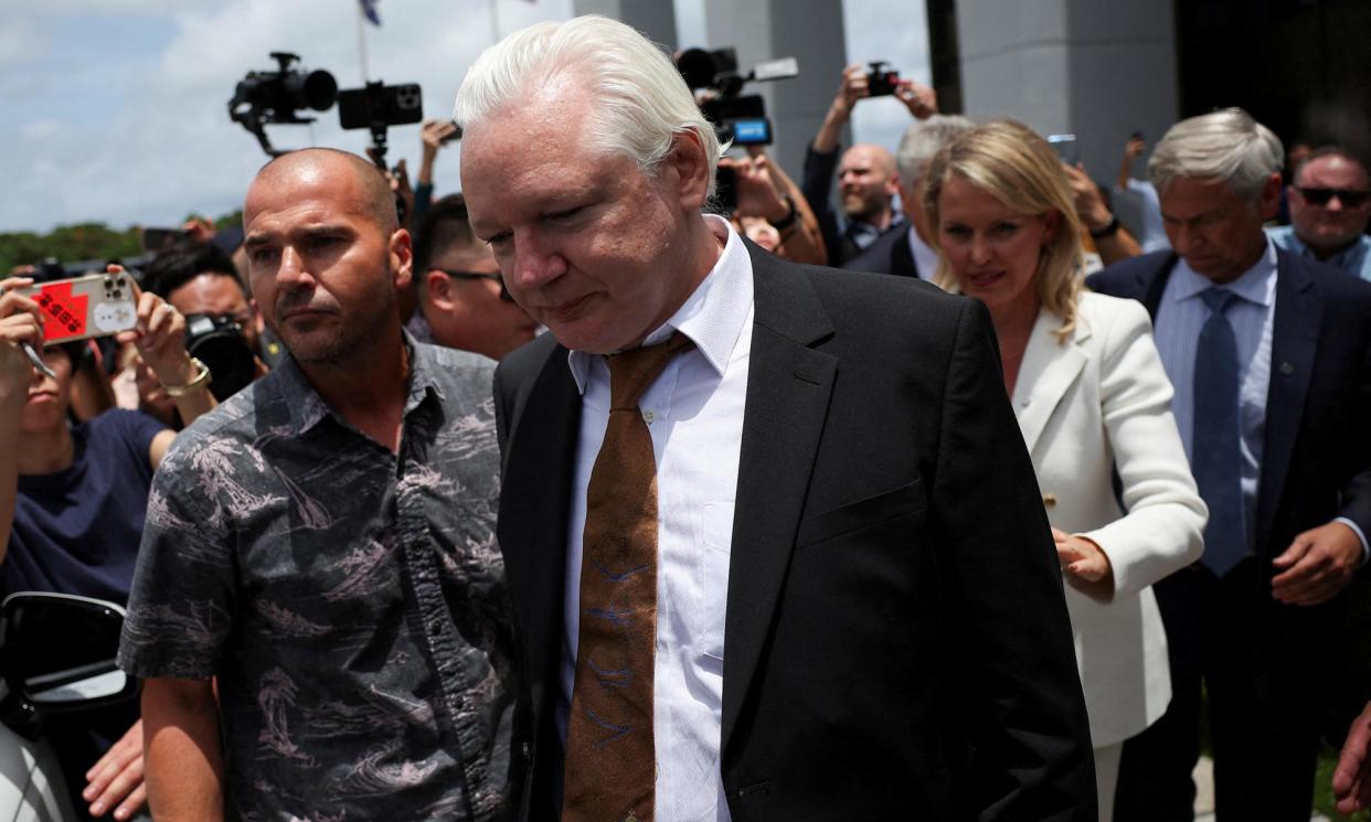 <span>WikiLeaks founder Julian Assange walks free from a court in the US Pacific island territory of Saipan, after pleading guilty to violating US espionage law. It brought an end to an extraordinary 14 year legal saga.</span><span>Photograph: Kim Hong-Ji/Reuters</span>