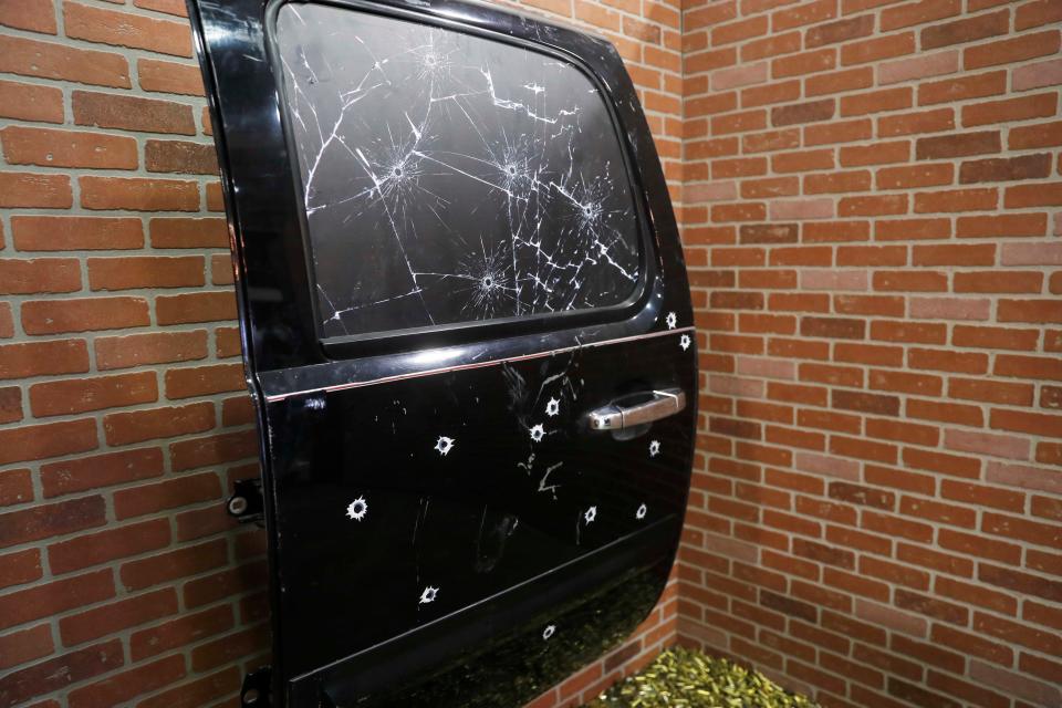 A bullet-riddled car door from the scene of Young Dolph's murder is part of the Dolphland pop-up museum at the Agricenter in Memphis.  The traveling museum celebrates the creativity, music and legacy of slain Memphis rapper Young Dolph.