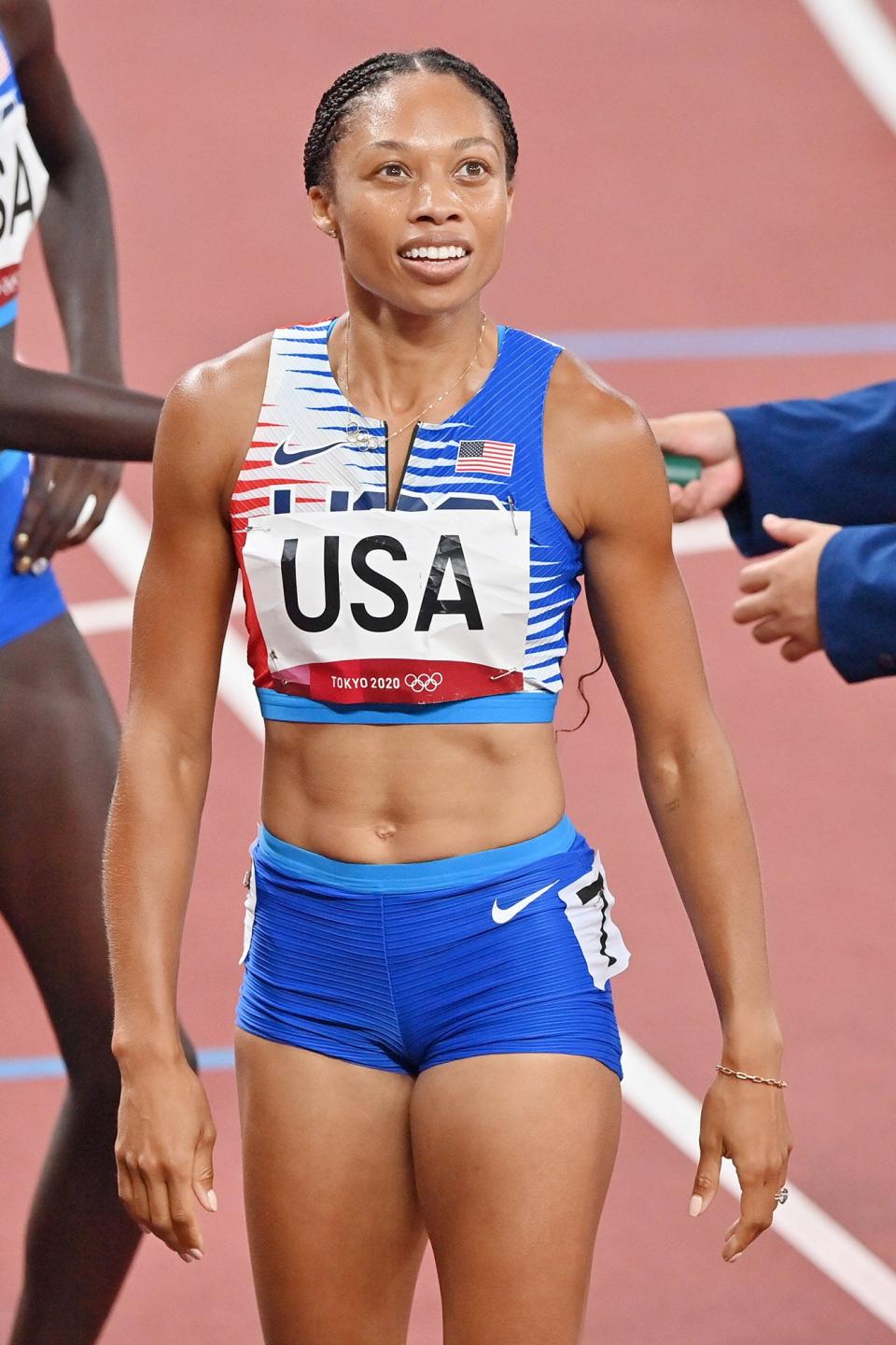 Allyson Felix of the USA reacts after winning the gold medal in the Women's 4 x 400m Realy Final during the Tokyo 2020 Olympic Games at Olympic Stadium in Tokyo, Japan on August 07, 2021.