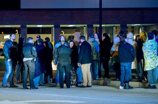 PHOTO: Witnesses are interviewed after a shooting at the West Side Walmart located at 335 S. Red Bank Road in Evansville, Ind., Jan. 20, 2023. (MaCabe Brown/Courier & Press via USA Today Network)