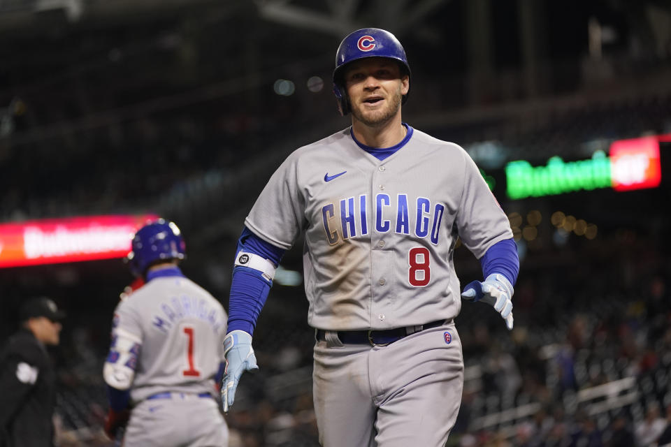 Chicago Cubs' Ian Happ (8) runs to the dugout after scoring a home run during the ninth of a baseball game against the Washington Nationals in Washington, Monday, May 1, 2023. (AP Photo/Manuel Balce Ceneta)