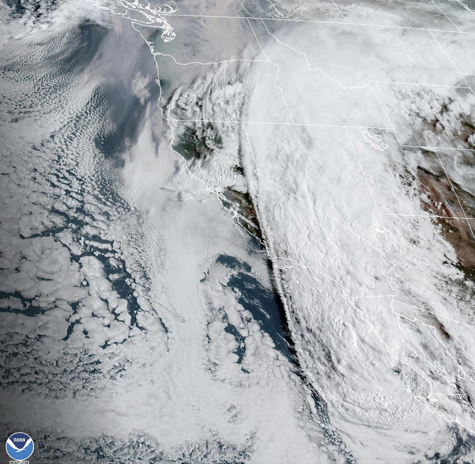 This Sunday, Aug. 20, 2023 11:20 a.m. EDT satellite image provided by the National Oceanic and Atmospheric Administration shows Tropical Storm Hilary, right, off Mexico’s Pacific coast. (NOAA via AP)