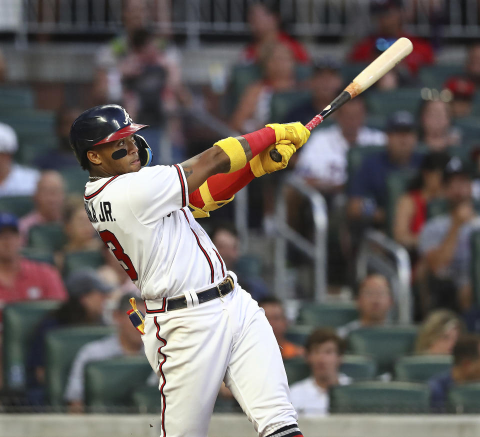 Atlanta Braves outfielder Ronald Acuna hits a 2-run homer to take a 7-6 lead over the San Francisco Giants during the fourth inning of a baseball game on Tuesday, June 21, 2022, in Atlanta. (Curtis Compton Atlanta Journal-Constitution via AP)