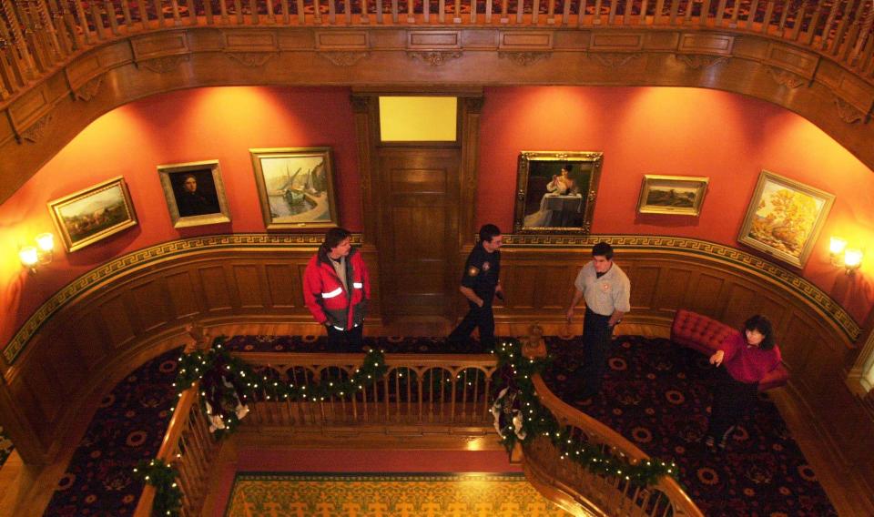 Yoko Bishop shows firefighters around a renovated Governor’s Mansion in the undated file photo. After a fire in December 1993 in Salt Lake City, it took 30 months to restore the historic mansion. | Ravell Call, Deseret News