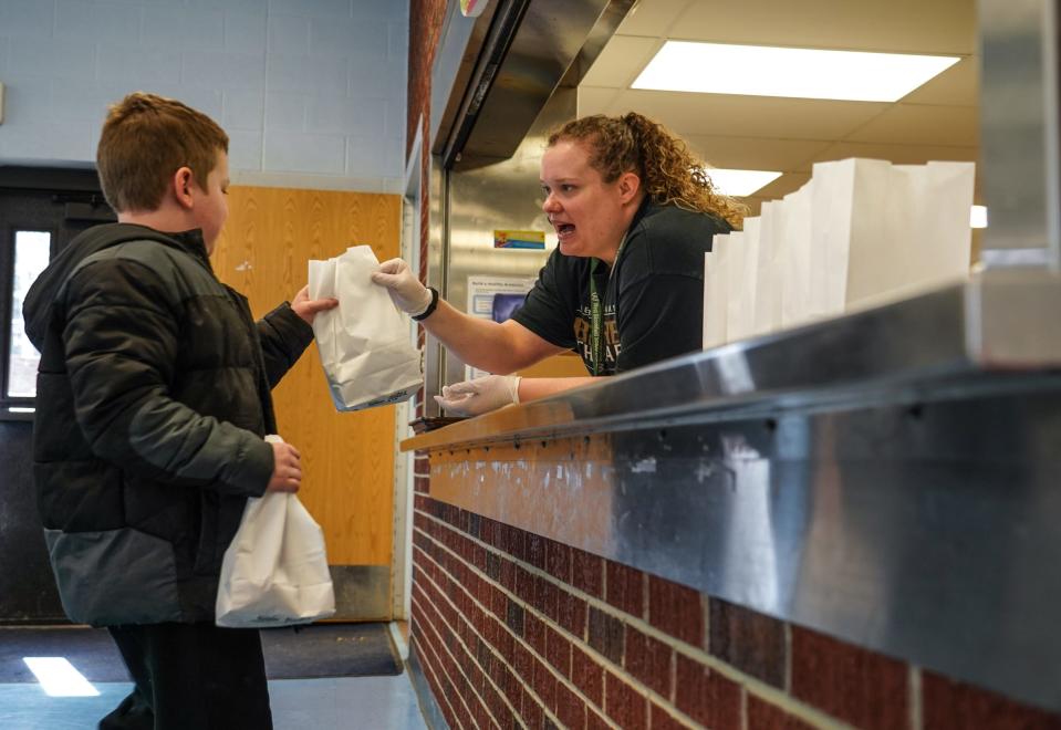 Roosevelt Elementary School student Connor Hall picks up a lunch from West Bloomfield School District on March 16 in Keego Harbor, Michigan.