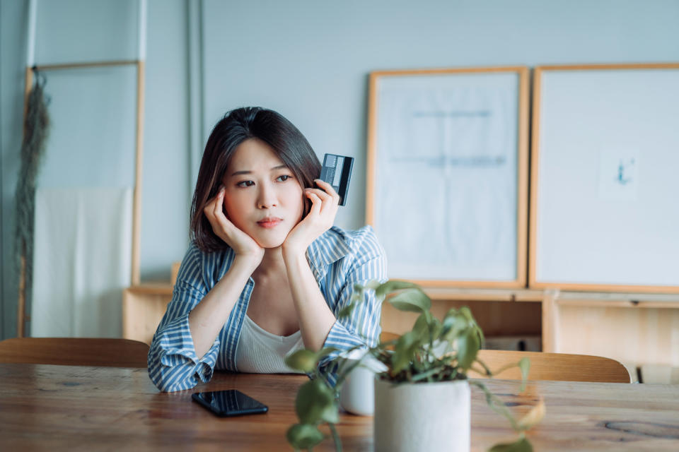 young woman worrying about money