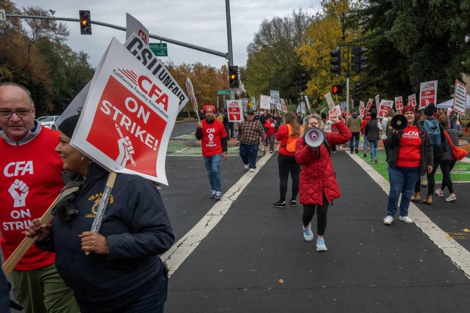 Sacramento State psychology professor of Sharon Furtak, center, chants “the union united will never be divided” during a one-day rolling strike on at the school Thursday, Dec. 7, 2023. The California Faculty Association on Monday Feb. 19, 2024, announced its members voted to approve a new contract with the CSU.