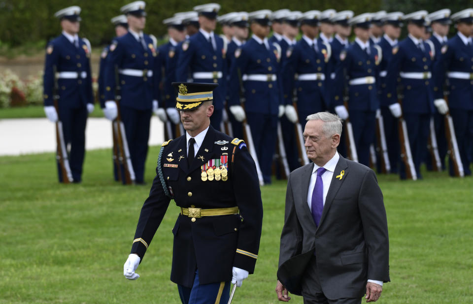 FILE - In this Sept. 21, 2018, file photo, Defense Secretary Jim Mattis reviews the troops during the 2018 POW/MIA National Recognition Day Ceremony at the Pentagon. Outgoing Defense Secretary Jim Mattis is quoting President Abraham Lincoln in a farewell message to defense employees, urging them to stay focused on their mission. (AP Photo/Susan Walsh, File)