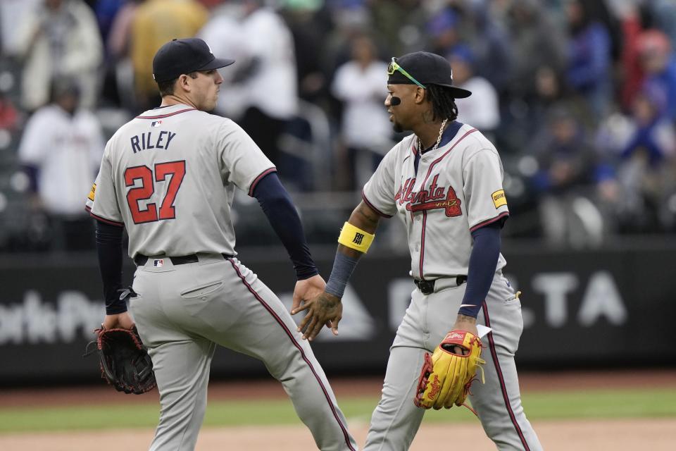 Atlanta Braves' Ronald Acuña Jr., right, celebrates with Austin Riley after a baseball game against the New York Mets, Saturday, May 11, 2024, in New York. The Braves won 4-1. (AP Photo/Frank Franklin II)