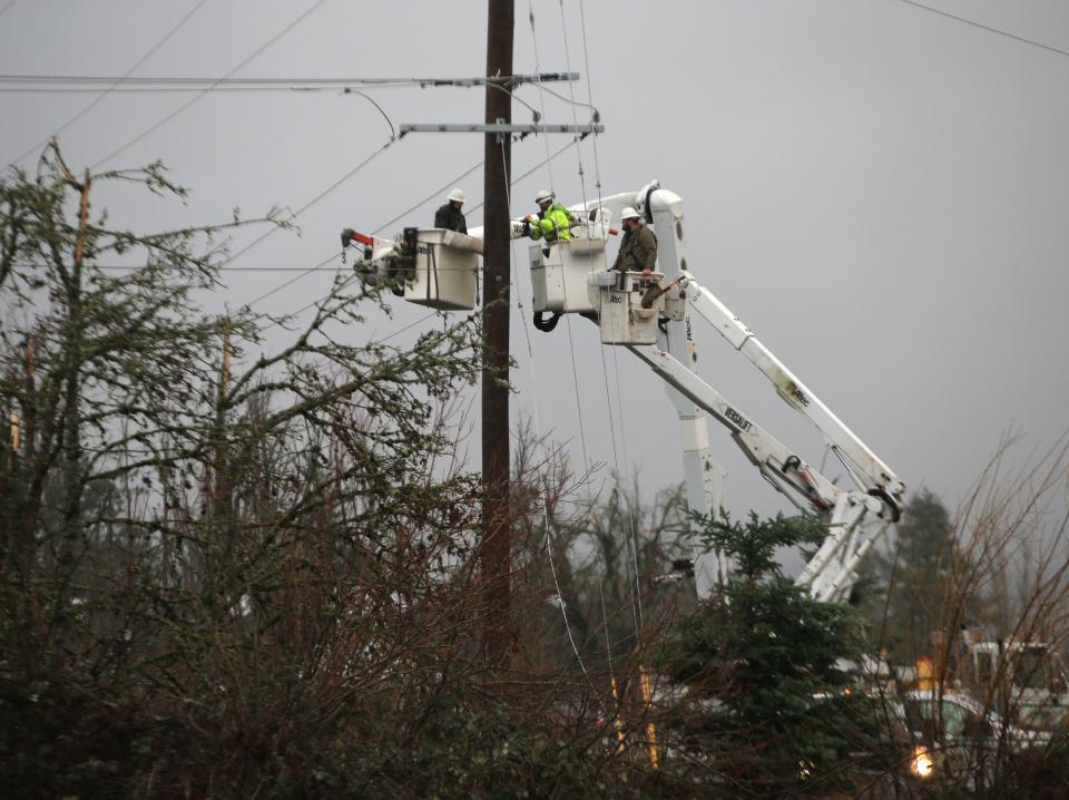 Crews work to restore power to Creswell  on Wednesday.