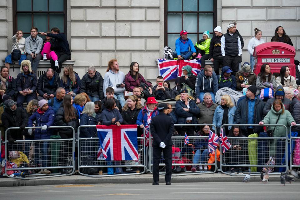 Onlookers lines the streets of London ahead of the Queen's funeral