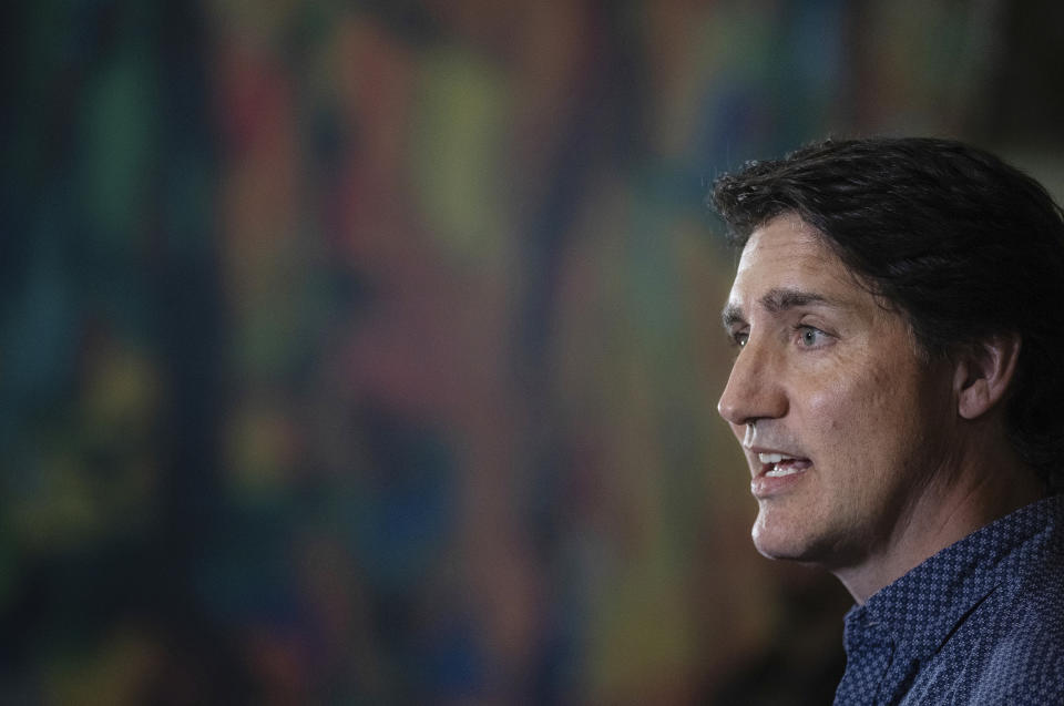 Prime Minister Justin Trudeau speaks about the wildfires in British Columbia and the Northwest Territories after visiting evacuees in Edmonton, Alberta, Friday, Aug. 18, 2023.(Jason Franson/The Canadian Press via AP)