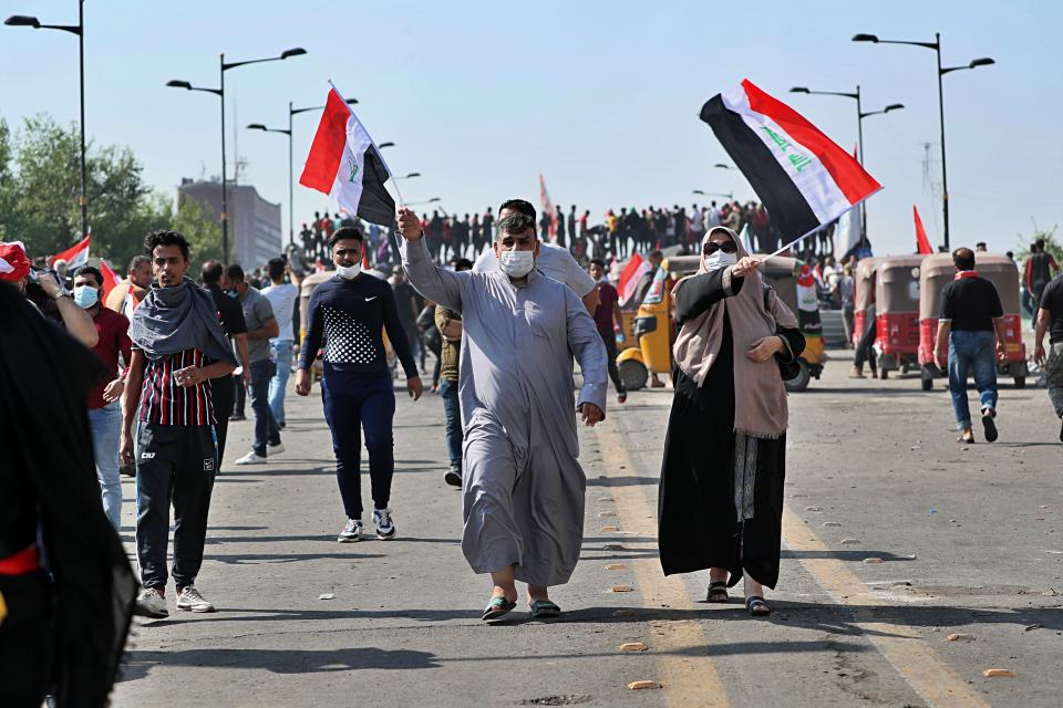 Anti-government protesters gather for a demonstration in Baghdad, Iraq, Saturday, Oct. 26, 2019. On Saturday, protesters gathered in Baghdad's Tahrir square. They tried on Friday to push their way toward the heavily-fortified Green Zone which houses government and diplomatic offices. Protesters also attacked offices of l Iran-backed militias. (AP Photo/Hadi Mizban)