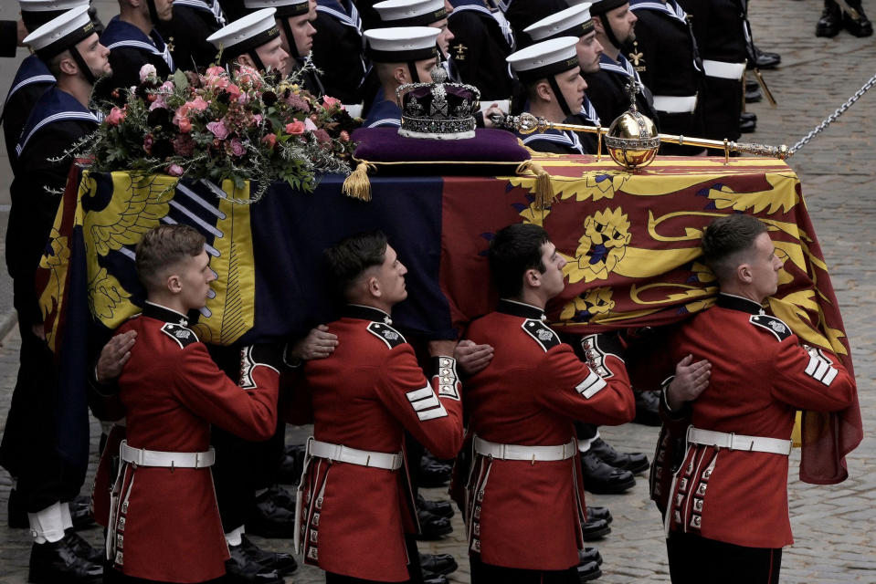 The coffin of Queen Elizabeth II is loaded onto a gun carriage, which was pulled by royal navy sailors on its journey from from Westminster Hall for the funeral service in Westminster Abbey.<span class="copyright">Nariman El-Mofty—Pool/AFP/Getty Images</span>