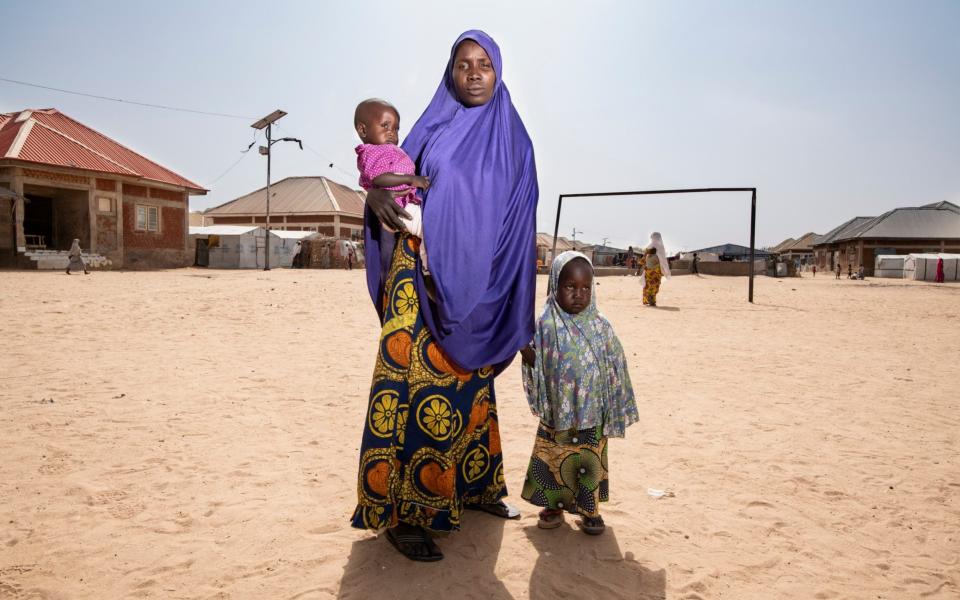 Halima with two of her children. She escaped Boko Haram after being held captive for four years - Simon Townsley/The Telegraph