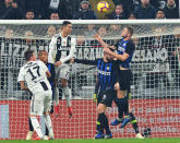 Juventus' Cristiano Ronaldo, 3rd from left, heads the ball during the Serie A soccer match between Juventus and Inter Milan at the Turin Allianz stadium, Italy, Friday, Dec. 7, 2018. (Andrea Di Marco/ANSA via AP)