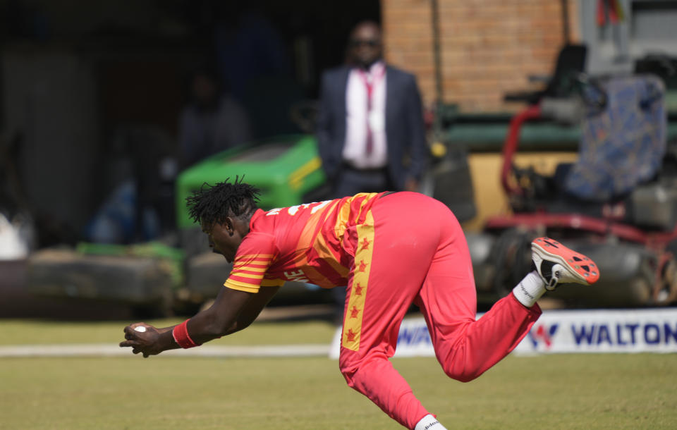 Zimbabwean player Richard Ngarava takes a catch on the final day of the One-Day International cricket match between Zimbabwe and Bangladesh at Harare Sports Club in Harare, Zimbabwe, Wednesday, Aug, 10, 2022. (AP Photo/Tsvangirayi Mukwazhi)