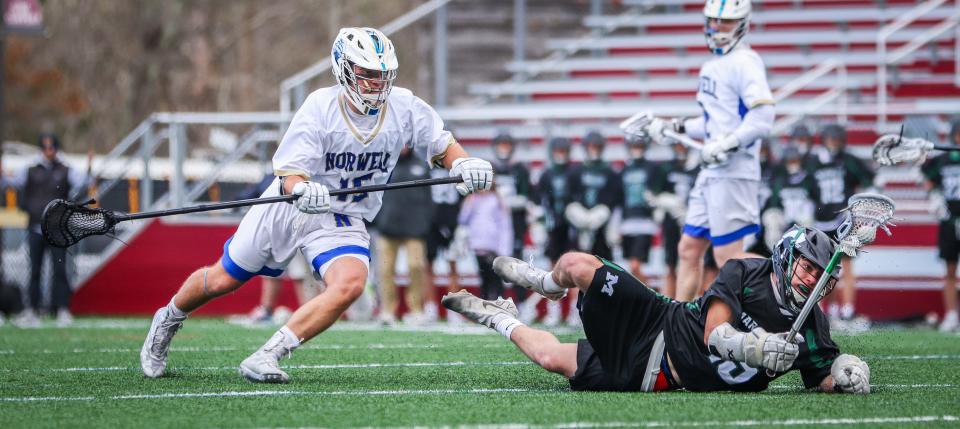 Norwell's Jack Coyle chases after the ball during a game against Marshfield at Falmouth High on Tuesday, April 19, 2022.