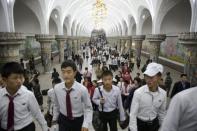 Commuters make their way through a subway station visited by foreign reporters during a government organised tour in Pyongyang, North Korea October 9, 2015. REUTERS/Damir Sagolj