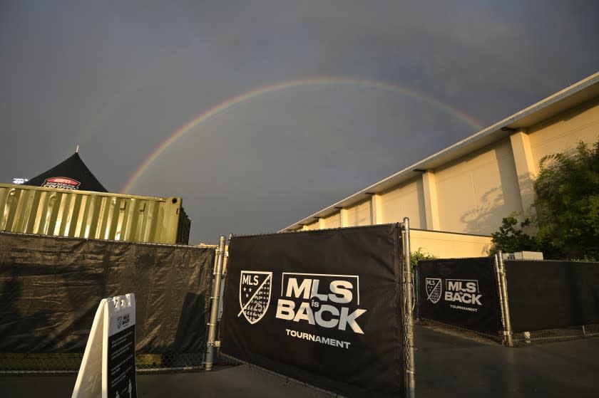 A double rainbow is viewed over the ESPN Wide World of Sports complex before an MLS soccer match between the New York Red Bulls and Atlanta United, Saturday, July 11, 2020, in Kissimmee, Fla. (AP Photo/Phelan M. Ebenhack)